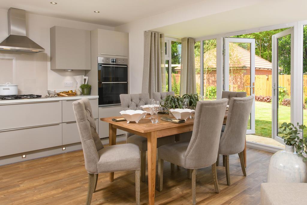 Open-plan kitchen with integrated appliances,...