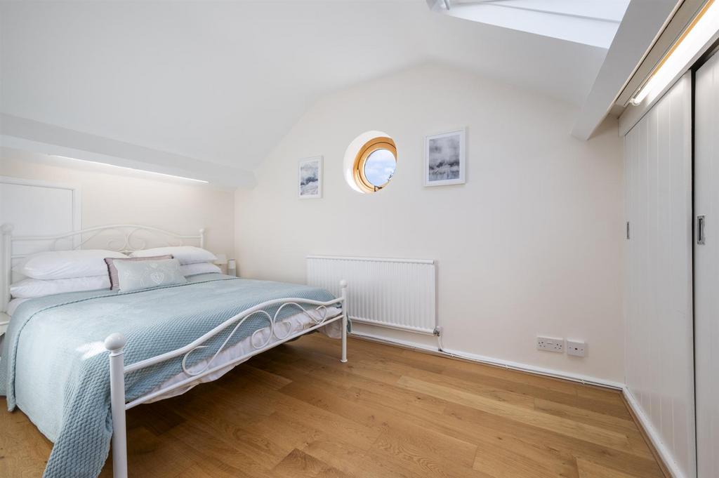 Bedroom Four - bed and porthole.jpg