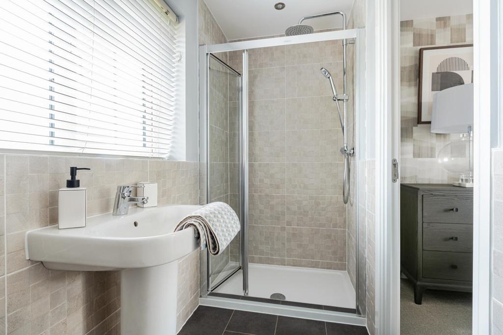 With an en suite shower room away from the...