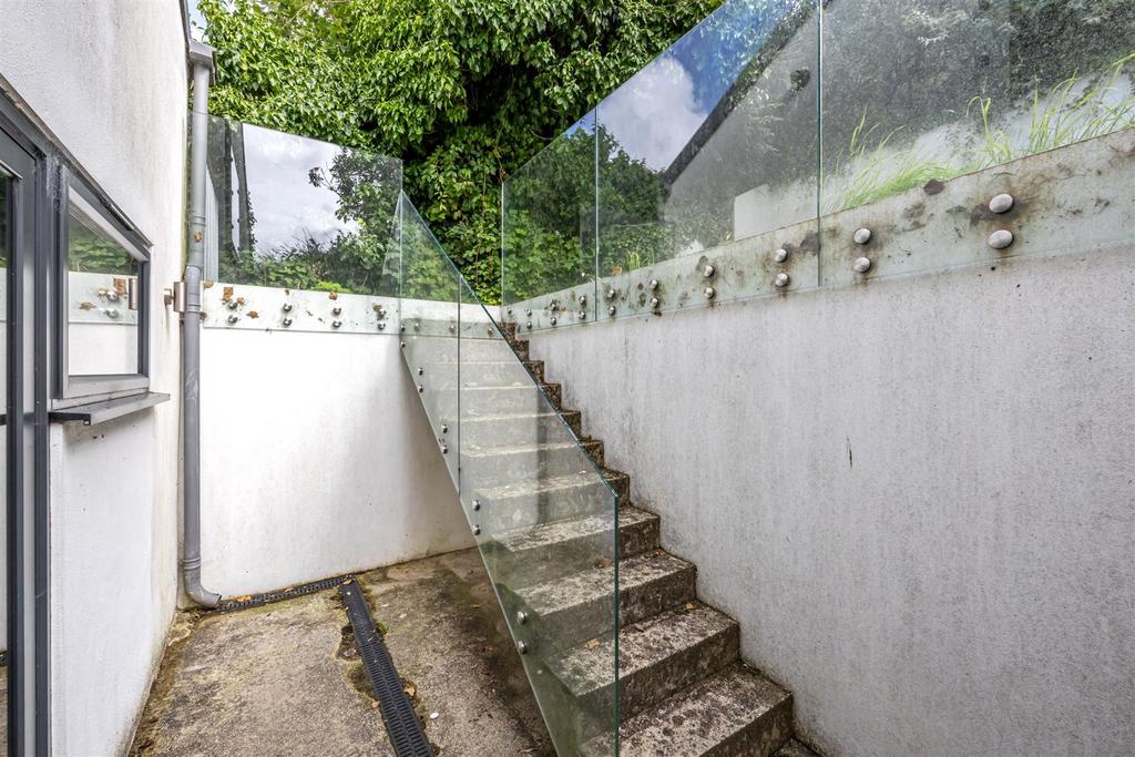 Stairs rising to Rear Garden