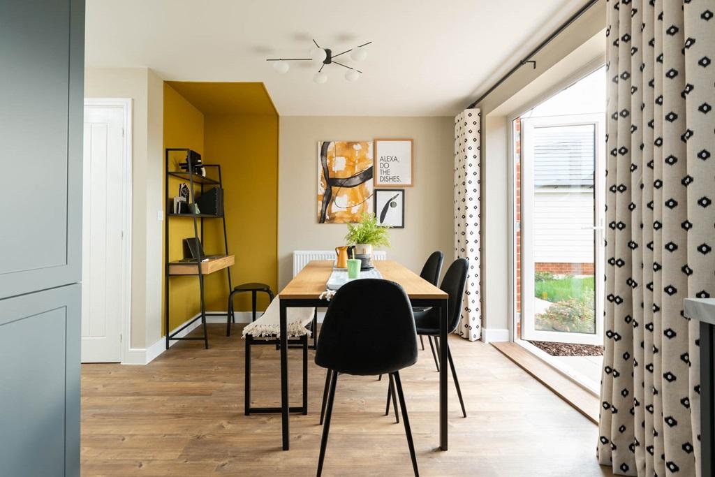 The open plan kitchen features double doors to...