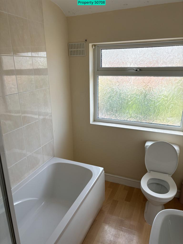 Bathroom with bath and shower