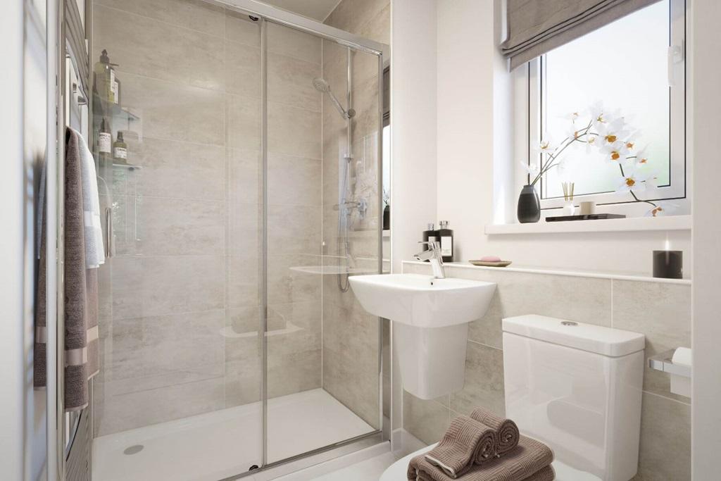 The en suite shower room is light and airy