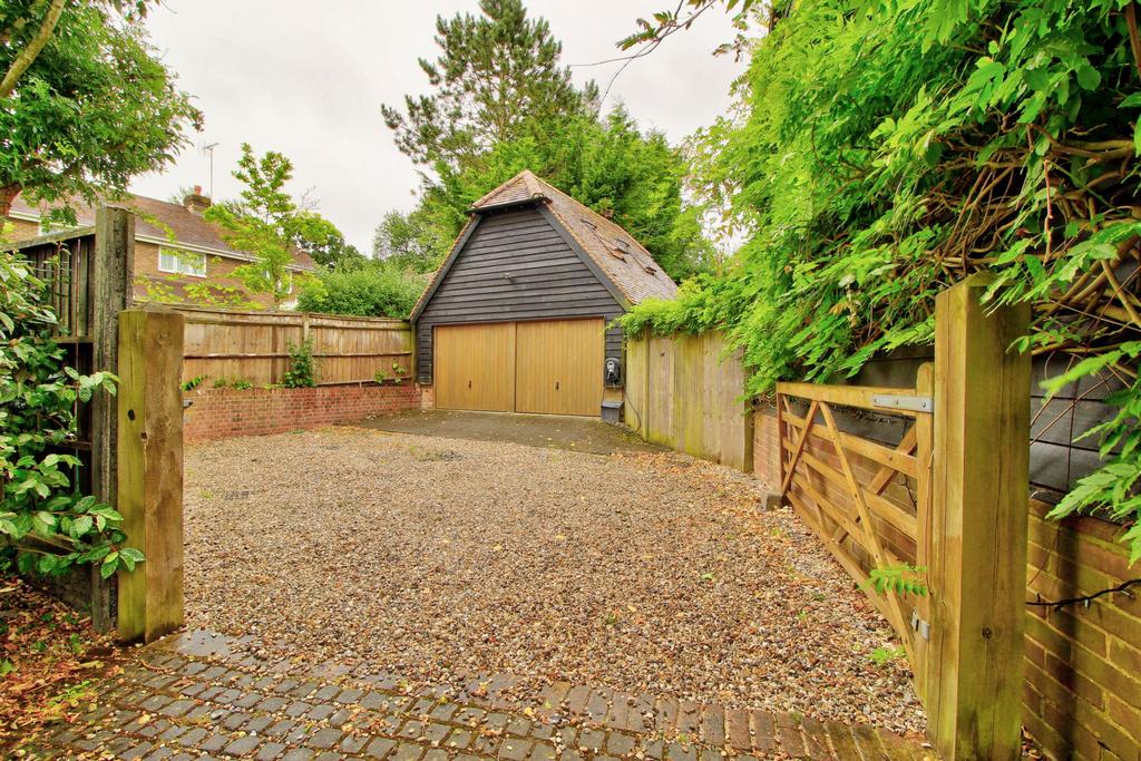 Garage behind second pair of gates