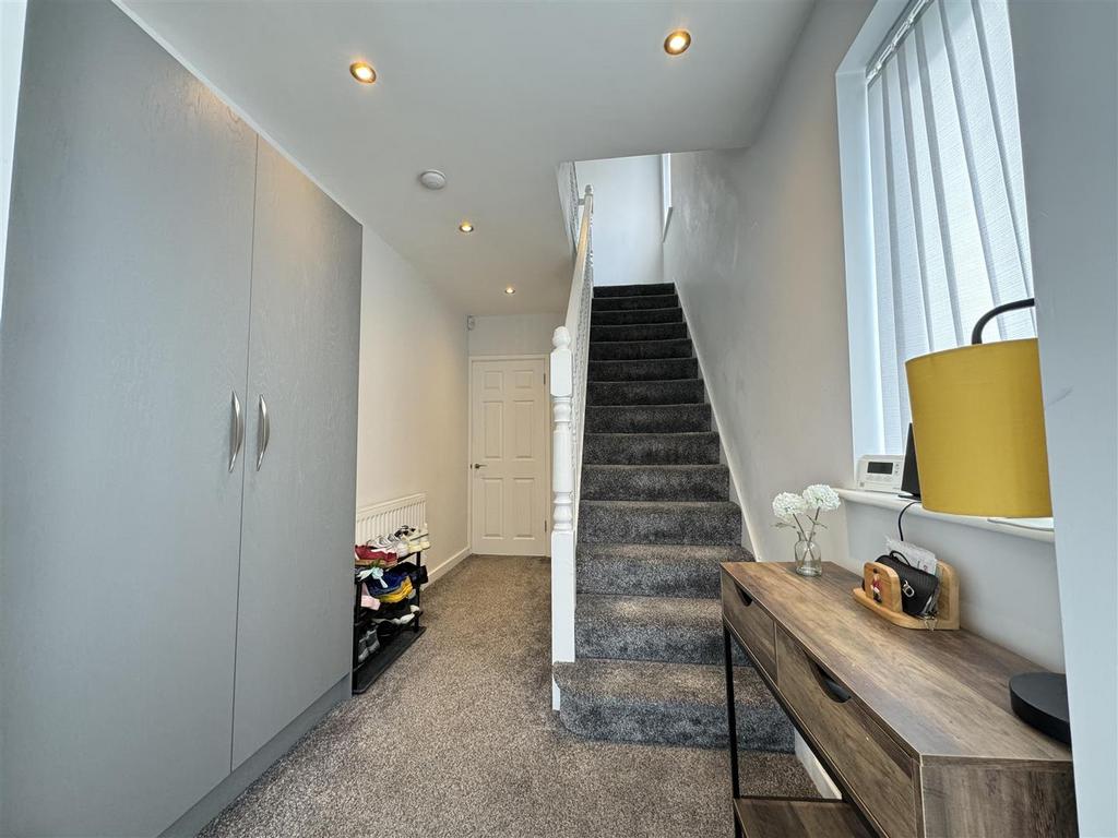 Stairs rising to the first floor