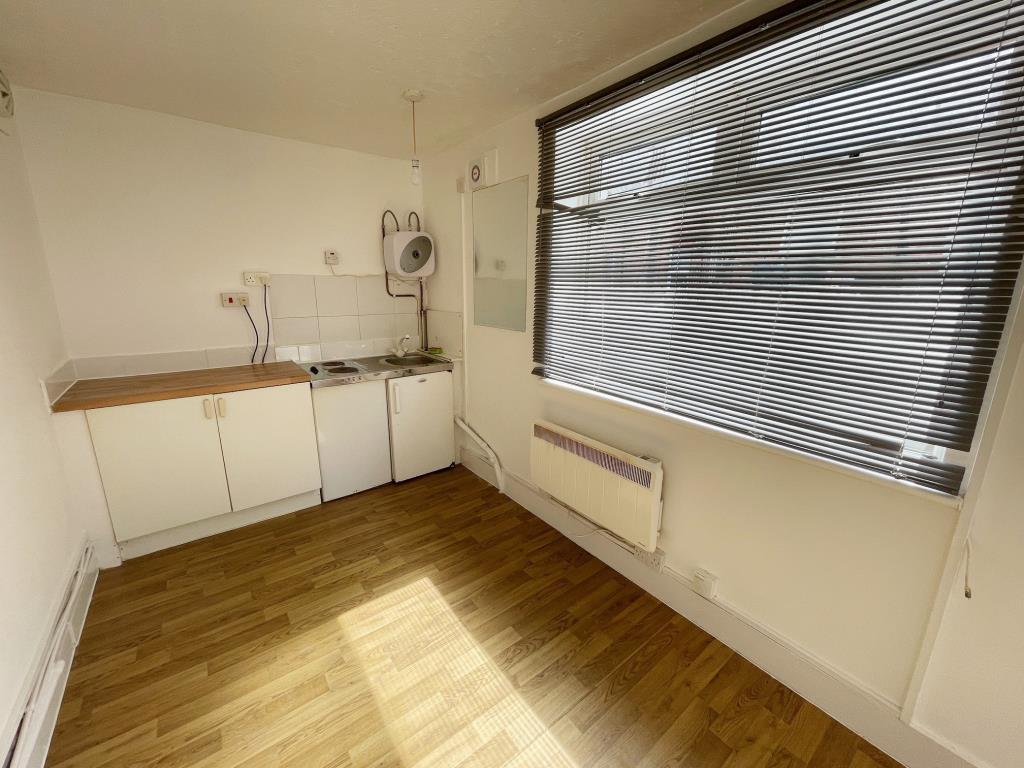 Living/Kitchen Area with window to the front and e
