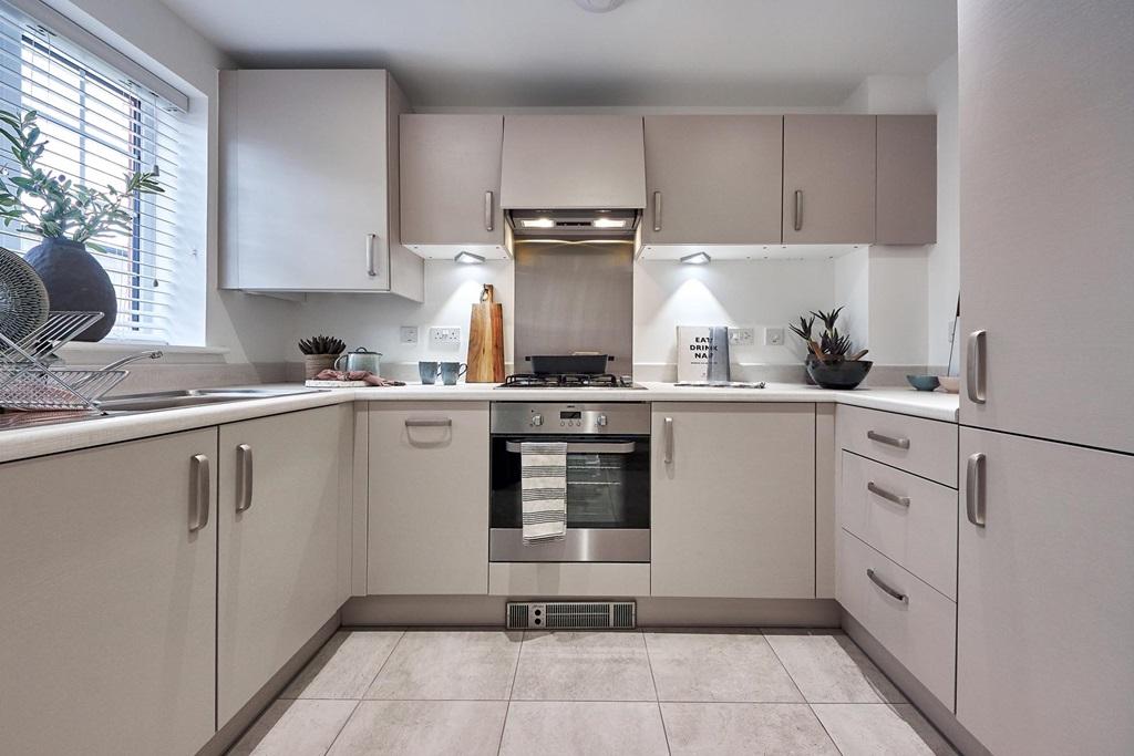 Large window floods the kitchen with natural light