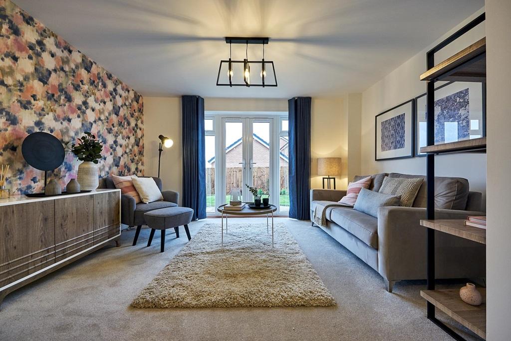 Double doors lead out to the garden from the...