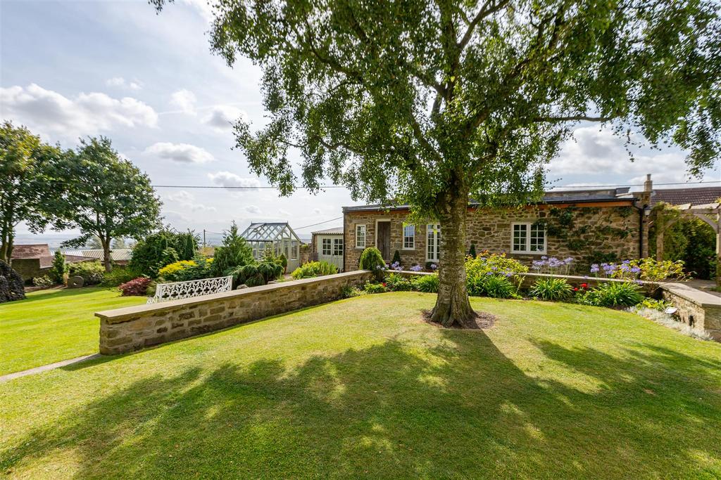 View to cottage and greenhouse