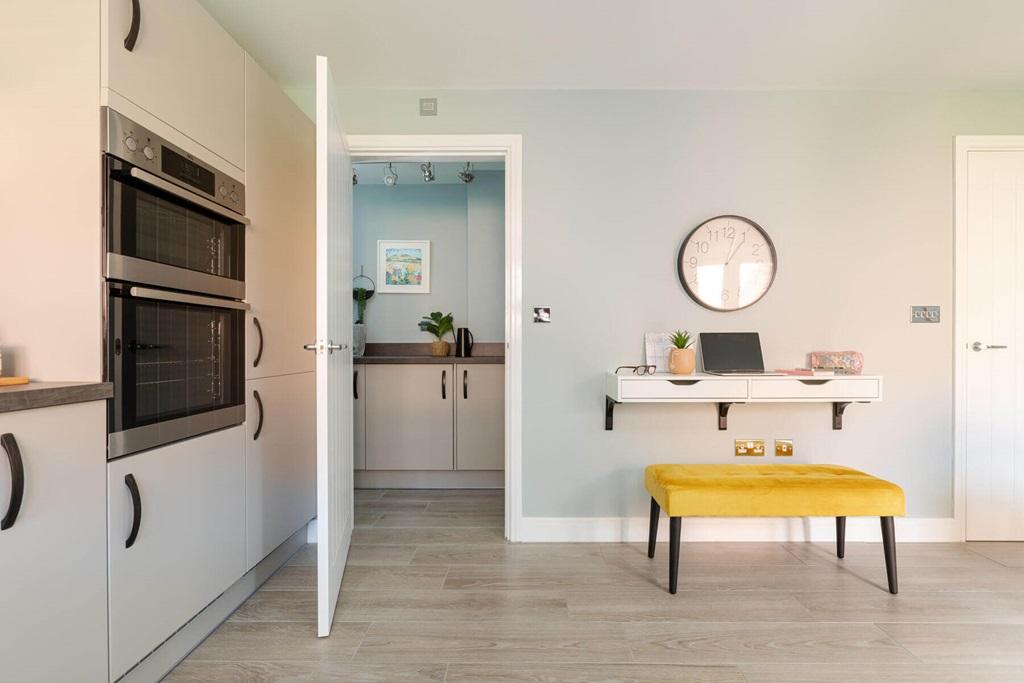 The kitchen also leads to a handy utility area