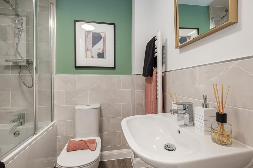 Bathroom with green painted wall above grey...