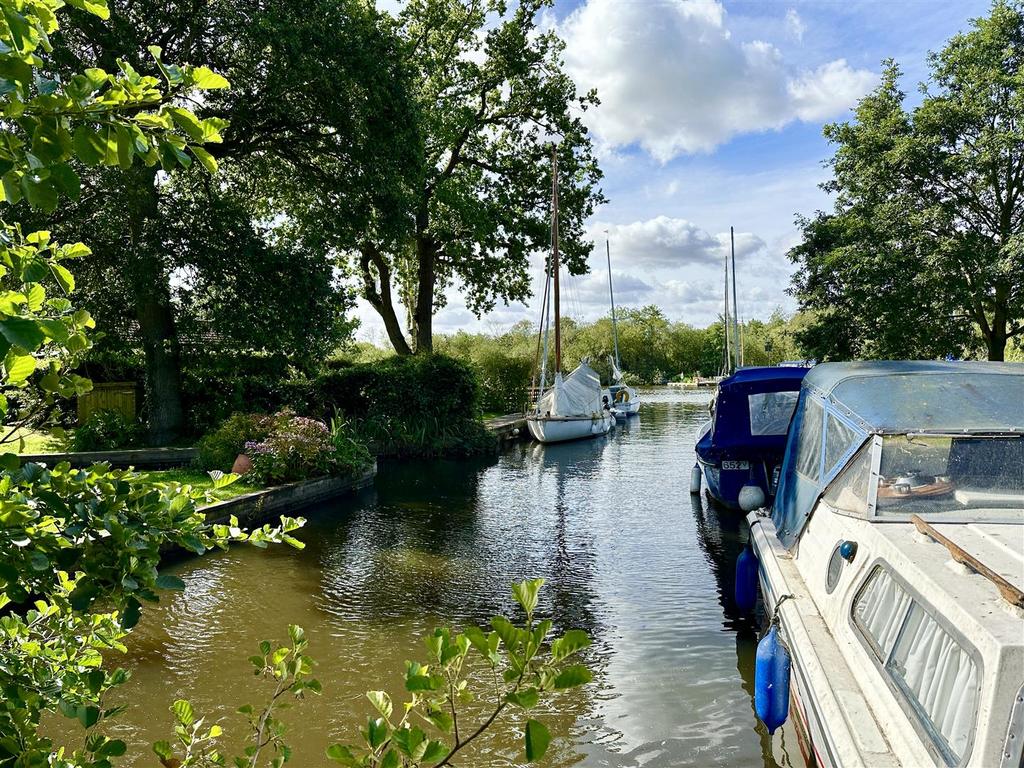 Dyke leading to Womack Water