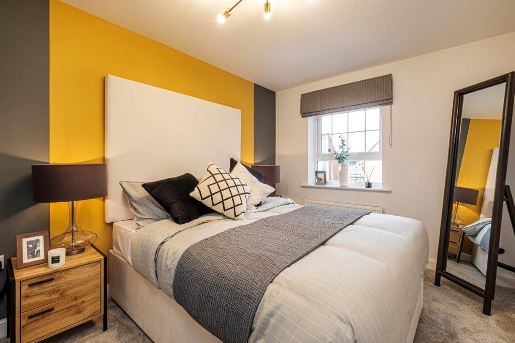 Double bedroom with yellow painted wall