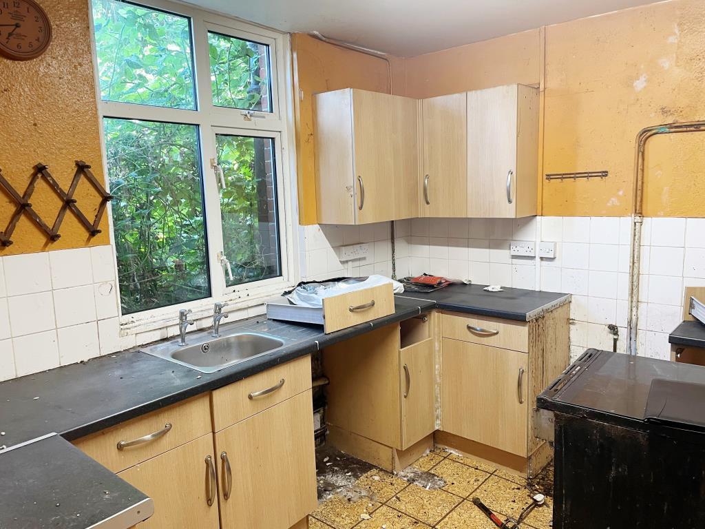 Ground floor kitchen to rear with units needing re