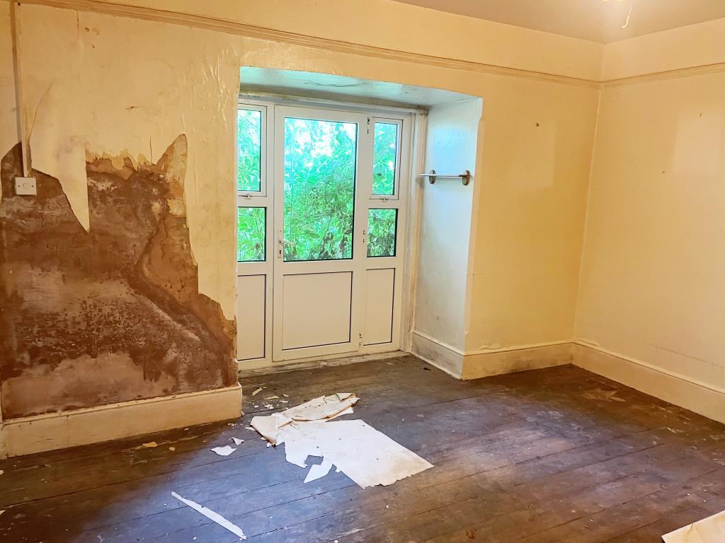 Ground floor living room with door to rear garden