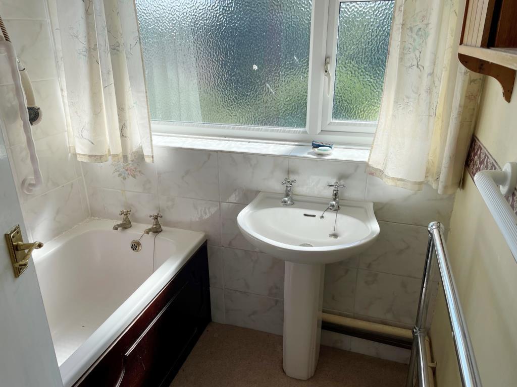 Bathroom and sink with white suite