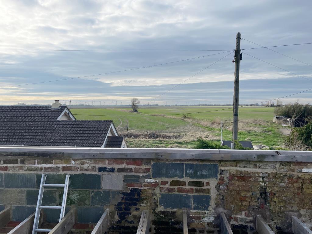 View over the Fens to the front of the cottage in