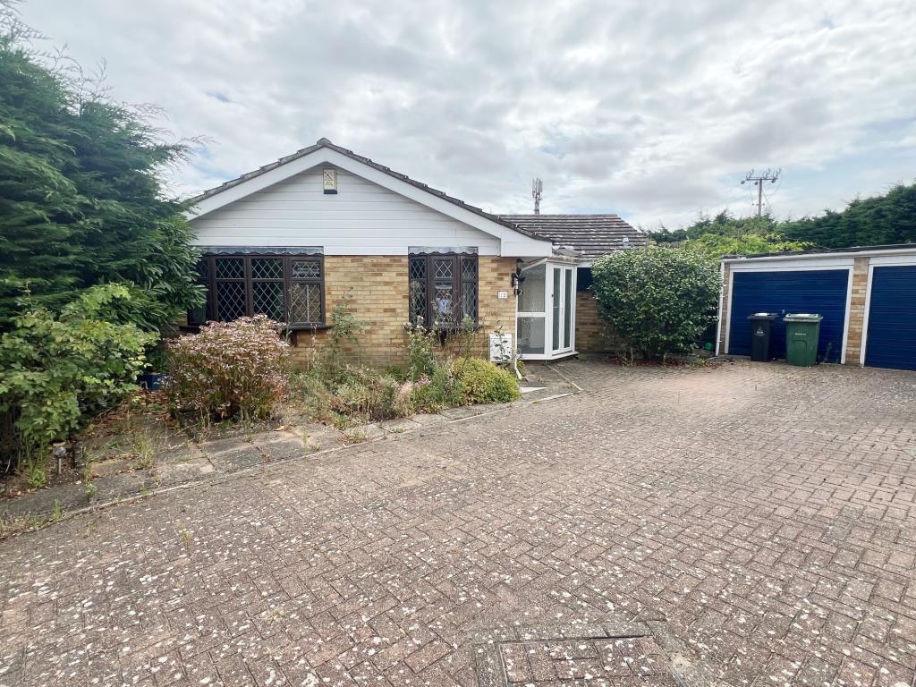 Front aspect showing garage and side access
