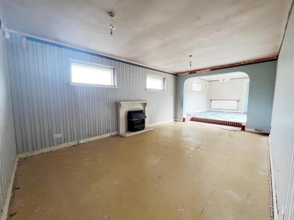 Living area with opening to dining area