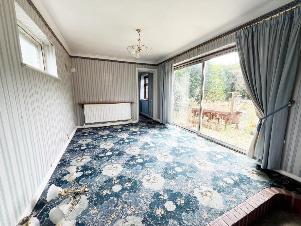 Dining space with sliding patio doors opening to r