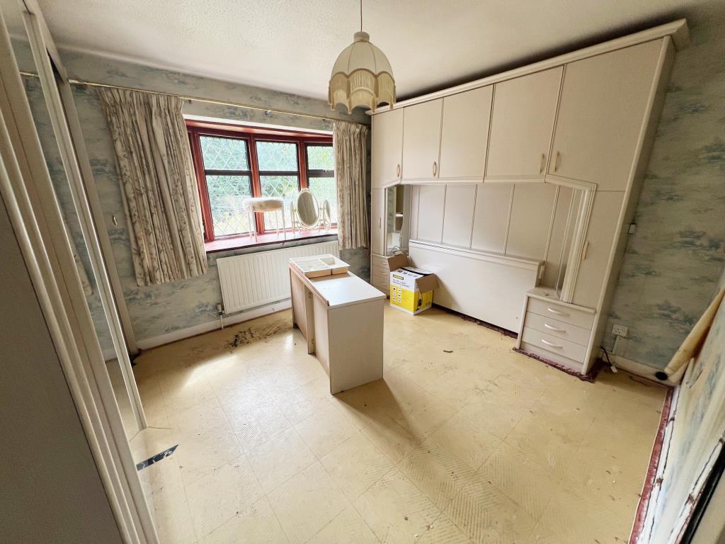 Double bedroom with some fitted bedroom furniture