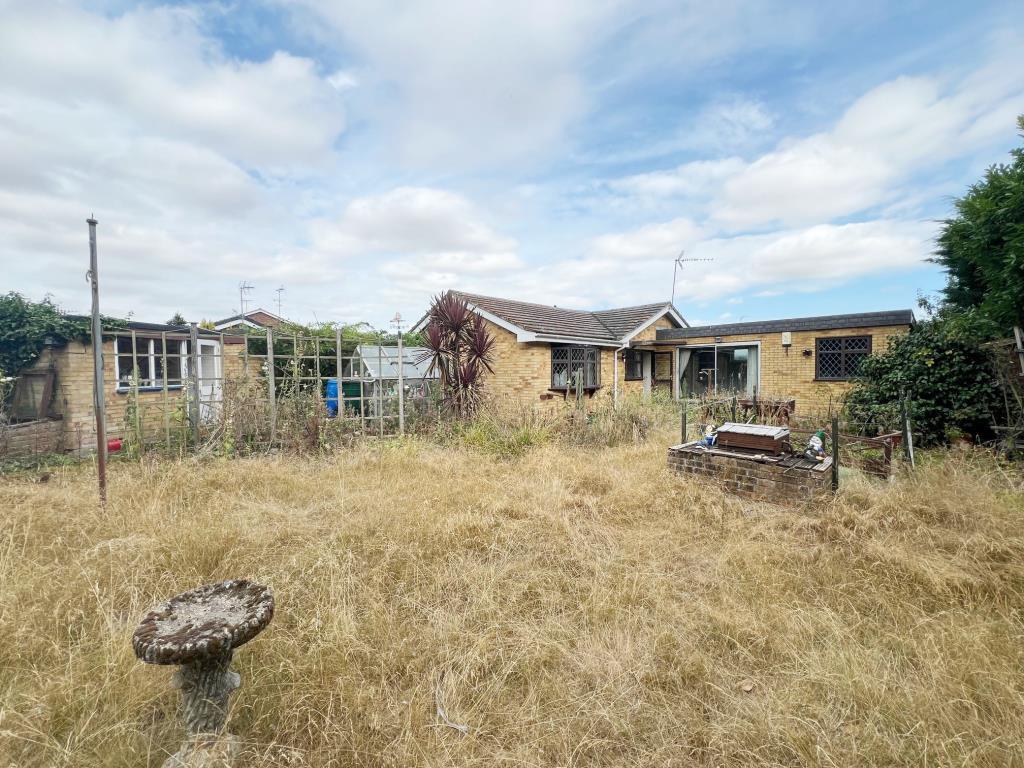 Rear aspect of bungalow showing storage/tool shed