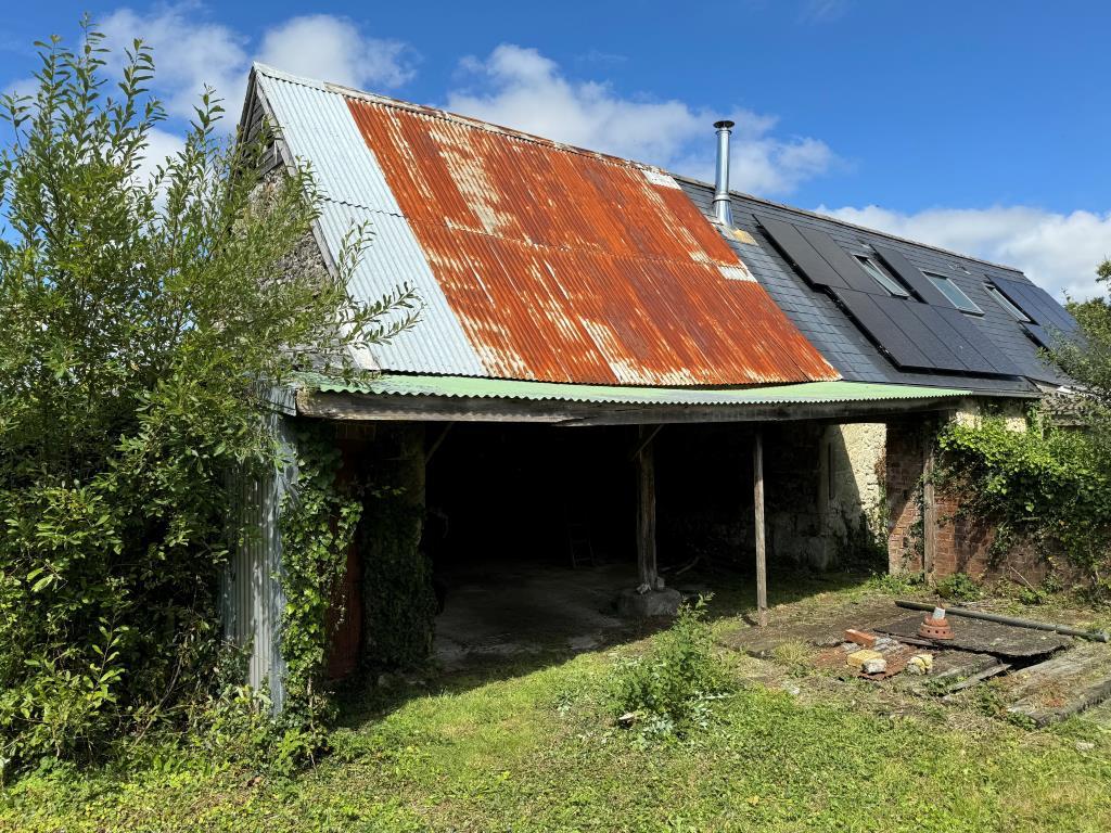 A View Looking Into the Larger Barn