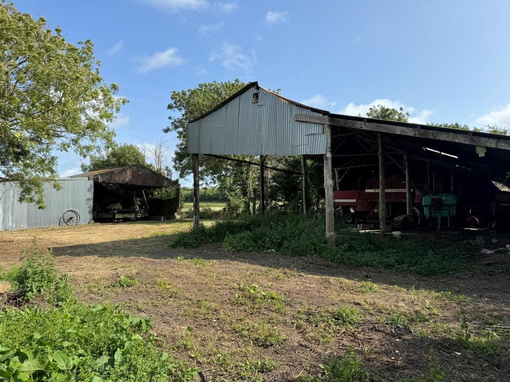 A Look Across the Site Showing Both Existing Barns