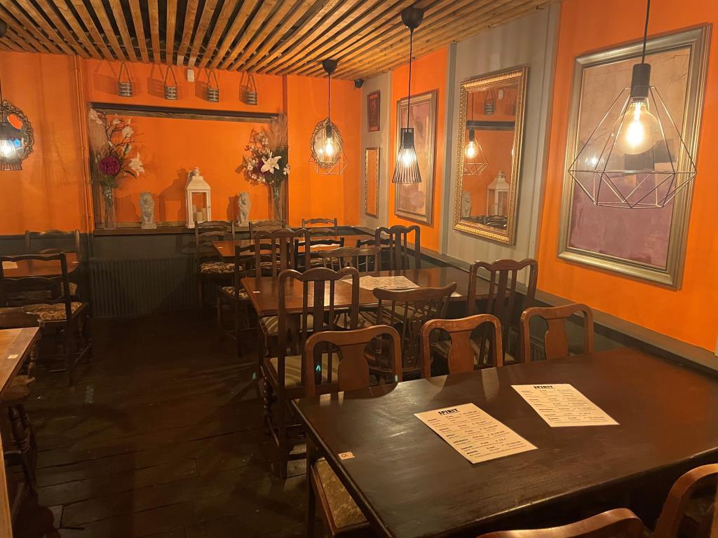 Ground floor seating area with tables