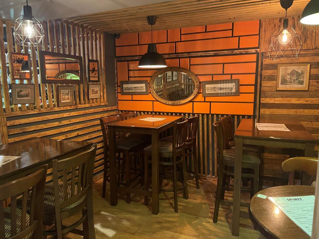 Further ground floor seating area with tables