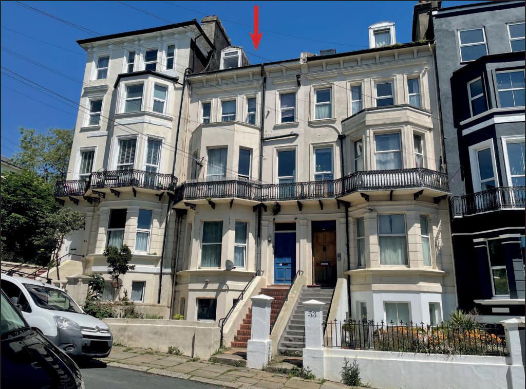 Mid-terrace property arranged as flats