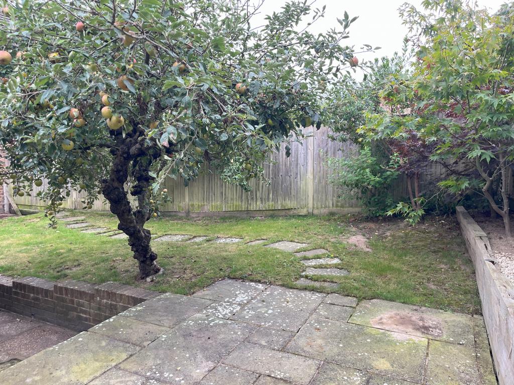 Raised patio area to rear.