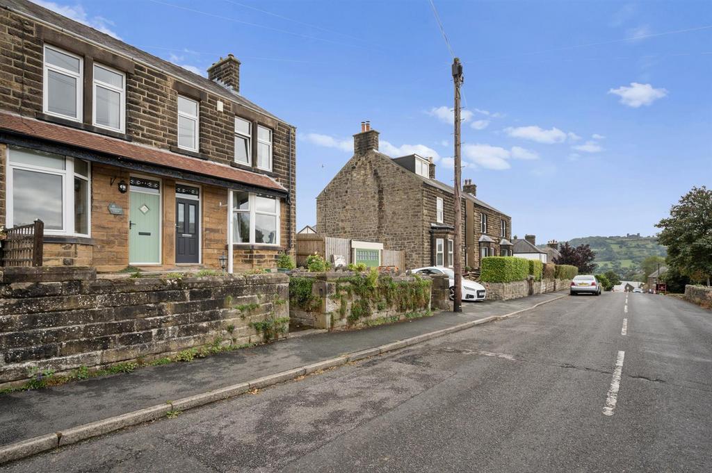 Street scene and view to Riber Castle.jpg