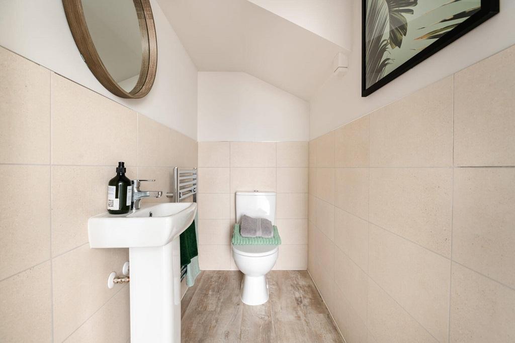 A guest cloakroom completes the ground floor