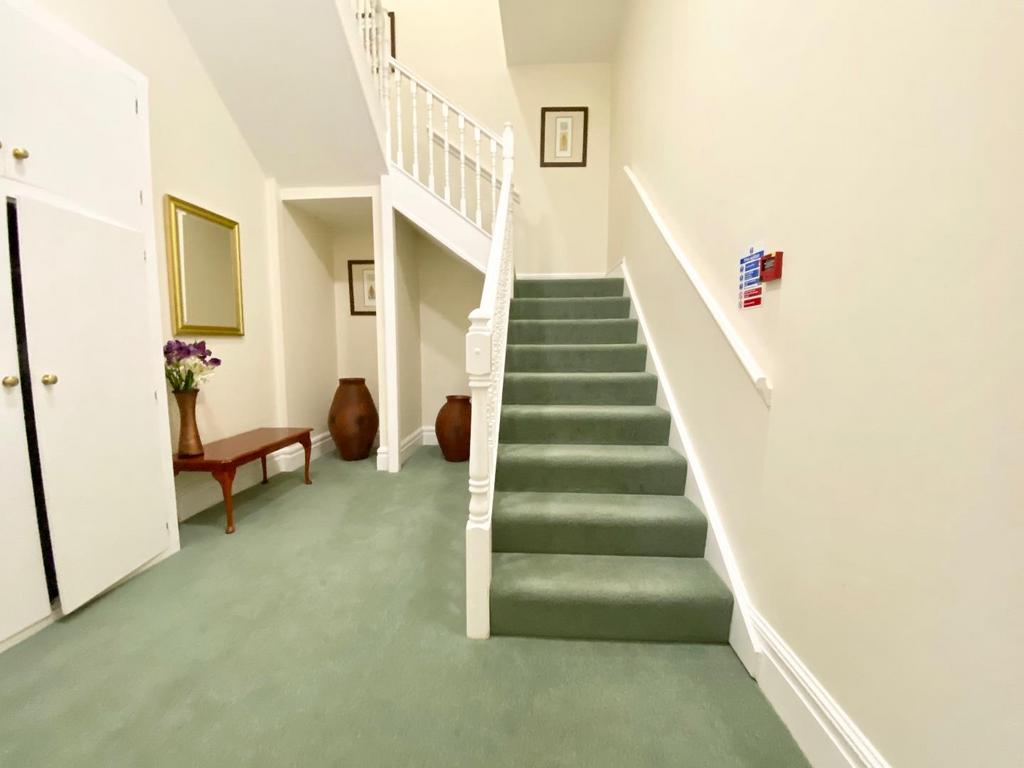 Staircase leads to first floor