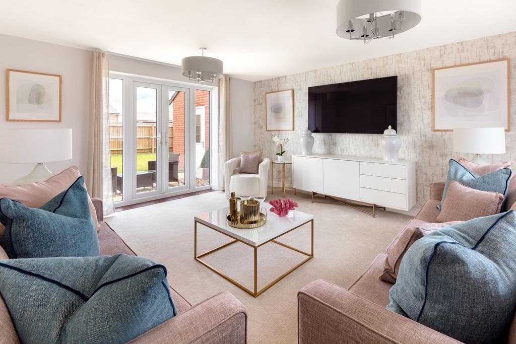 A social living room with French doors to the...