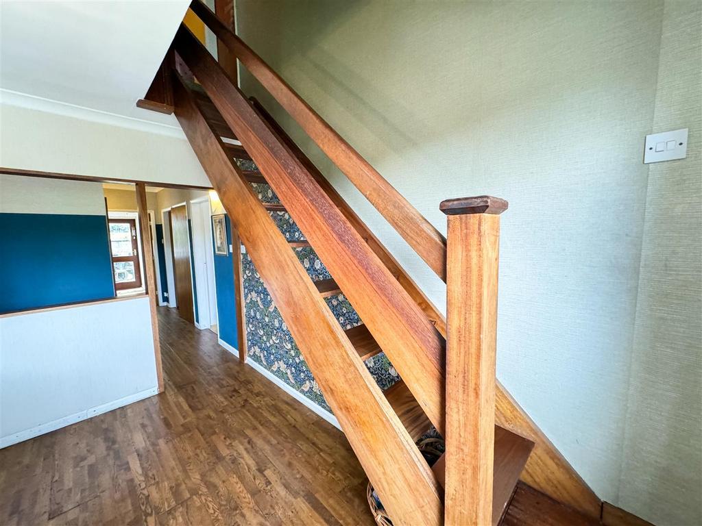 Stairs rising to the first floor landing