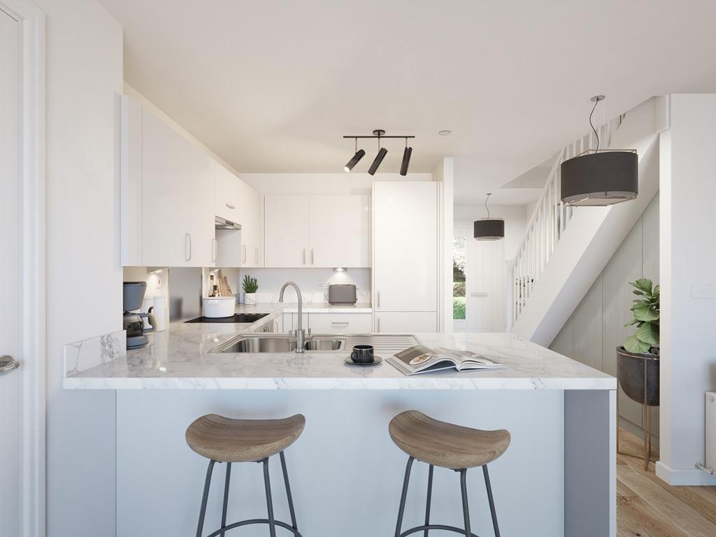 The kitchen features a sociable breakfast bar