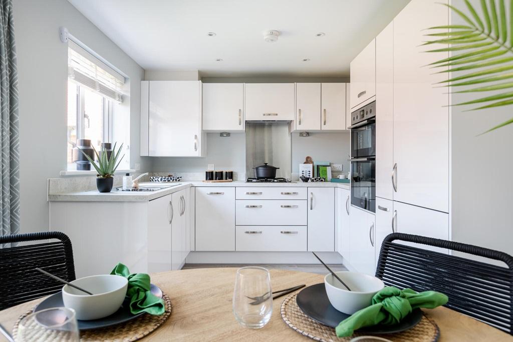 The kitchen offers a spacious open plan design