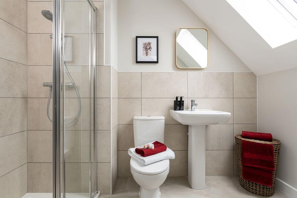 The en suite features a large double shower