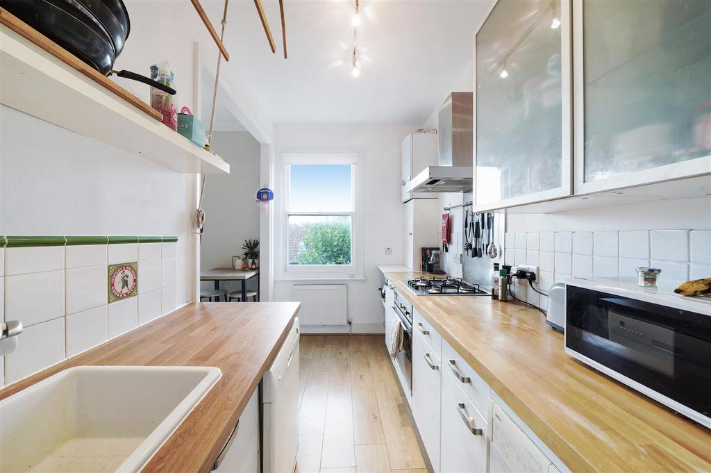 Solidwood worktops in modern fitted kitchen