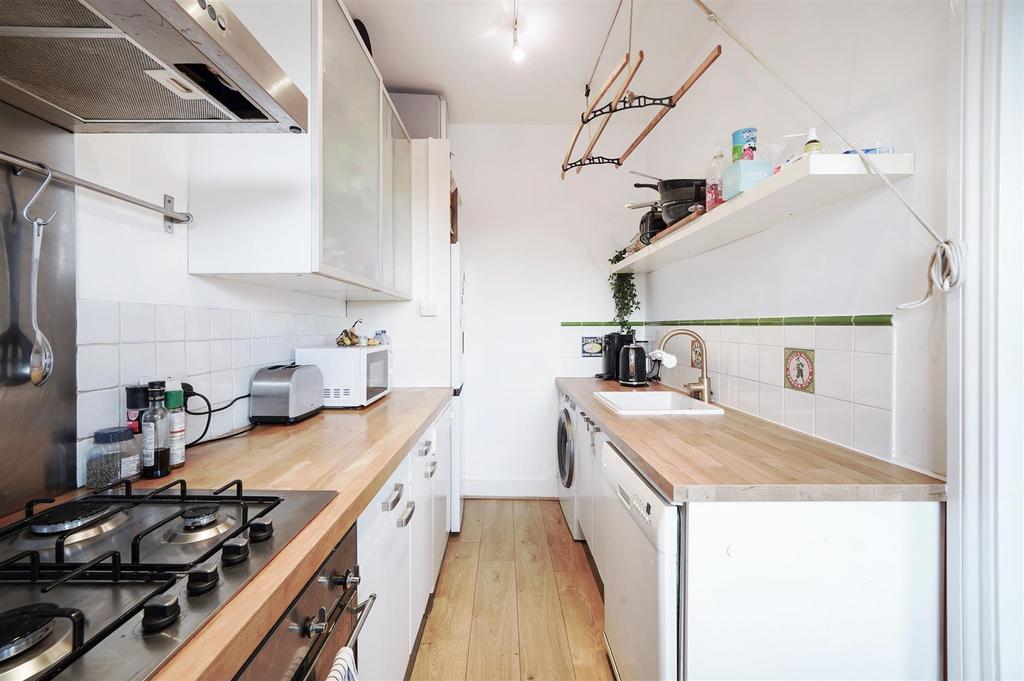 Solidwood worktops in modern fitted kitchen