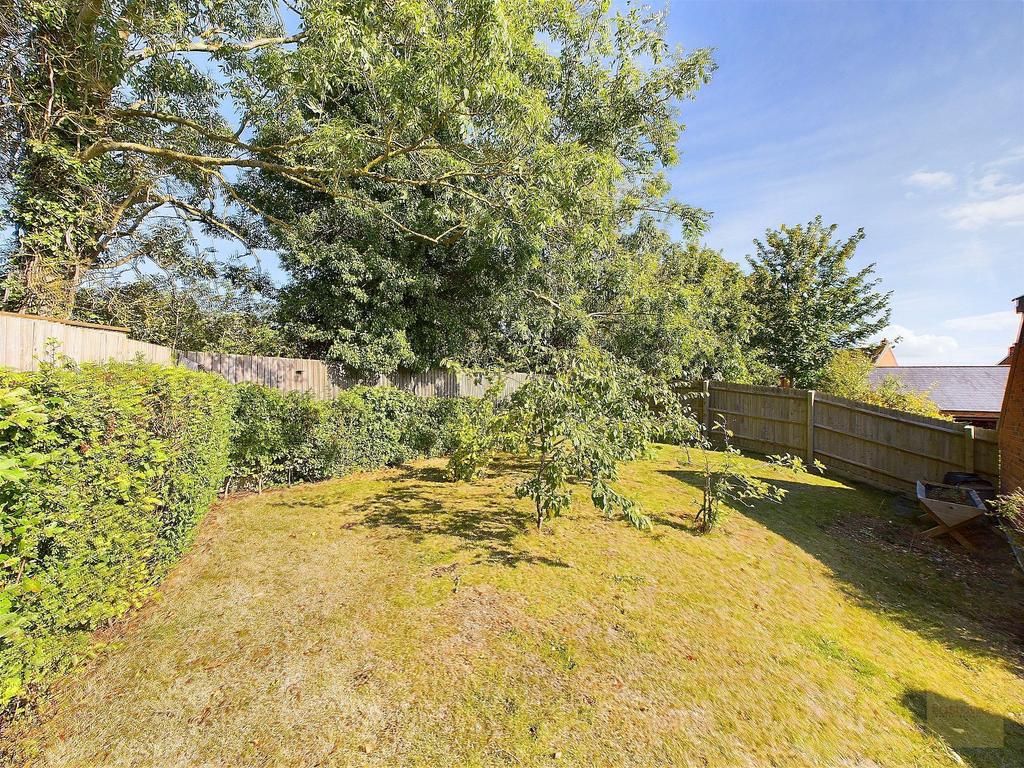 Fruit trees in the rear garden next to the garage