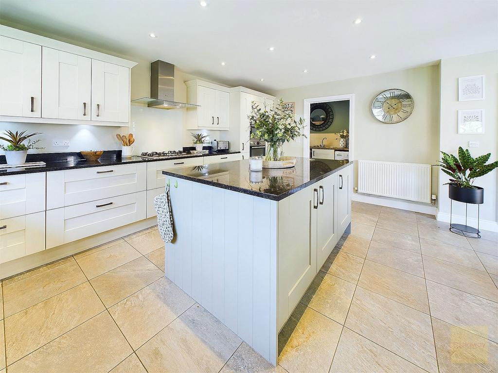 Kitchen with view towards utility room