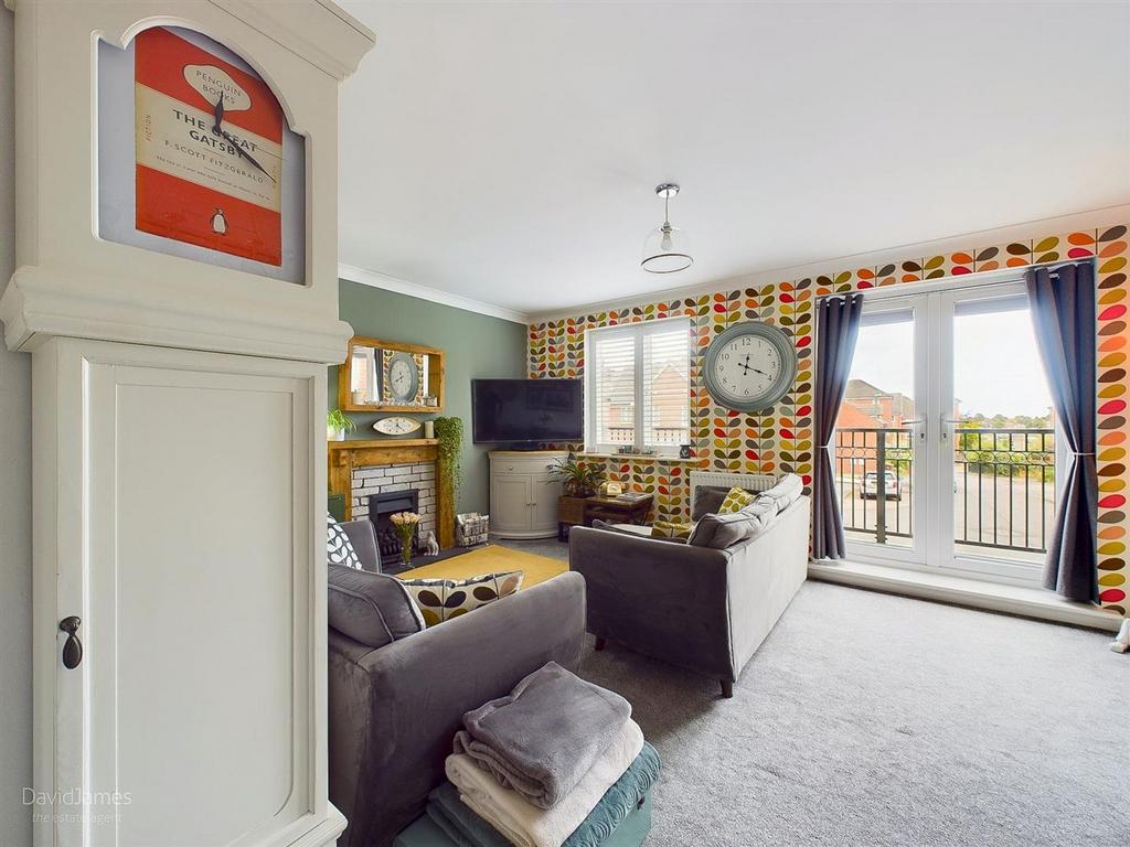 Lounge with french doors onto...
