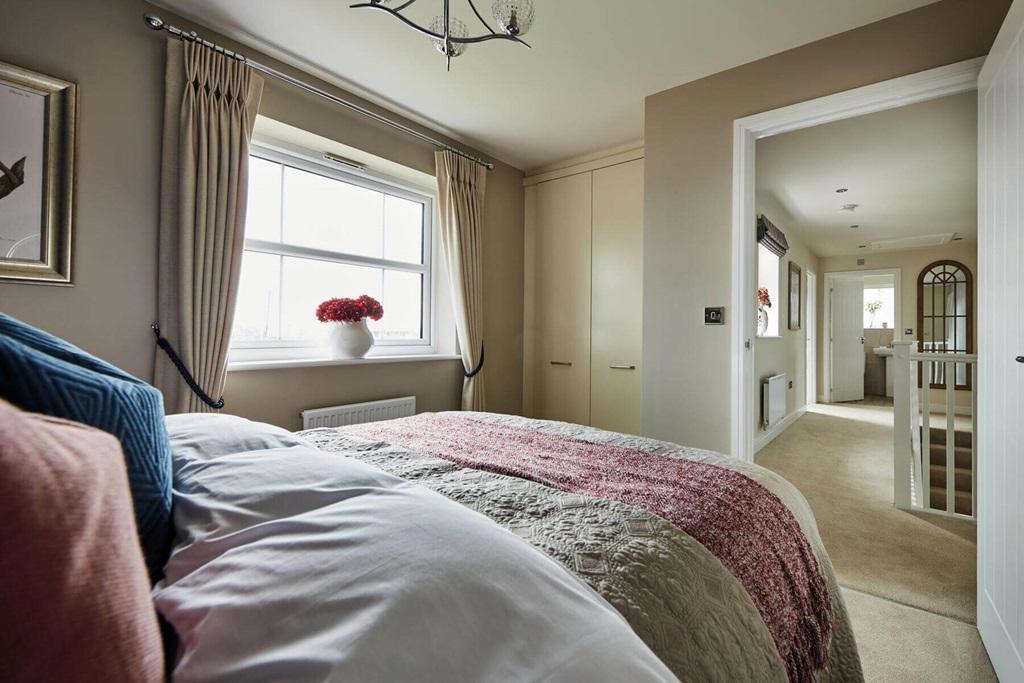 A second double bedroom also hosts an en suite,...