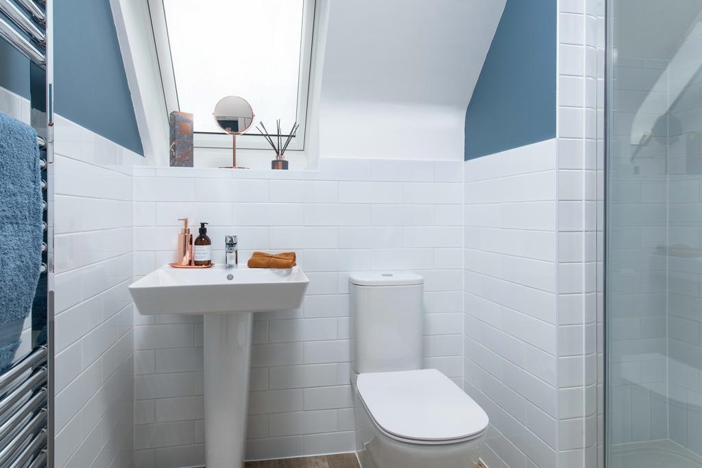 Top floor modern bathroom in a detached home