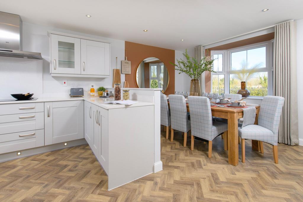 Open-plan kitchen &amp; bay-fronted dining area in...