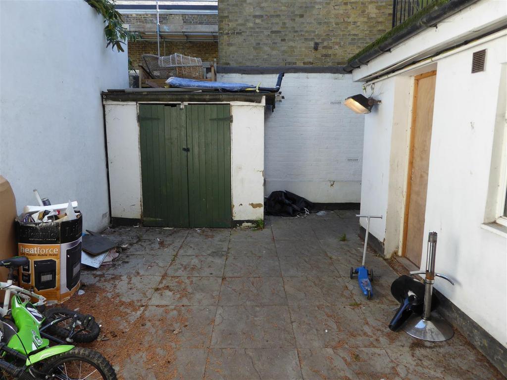 Patio and storage area for shops