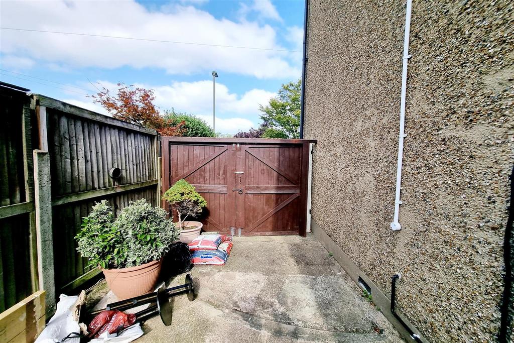 Double wooden gates to front: